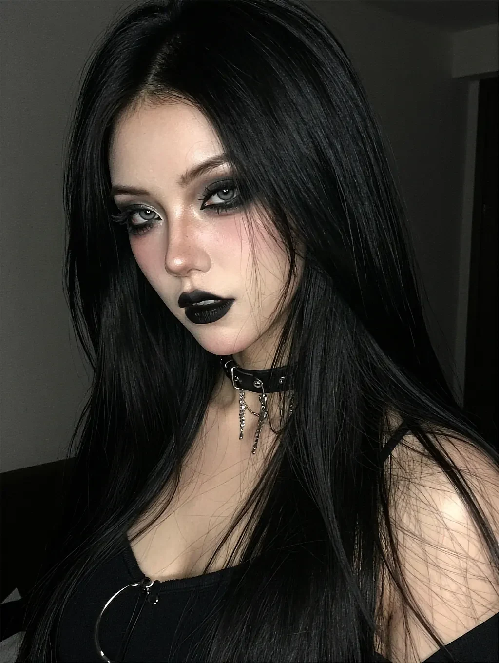Fictional AI character with long black hair, dark makeup, a choker and a lace top